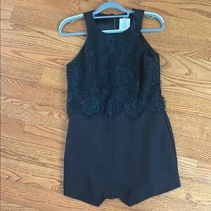 Chic Black Mini Dress with Textured Top and Fitted Waist